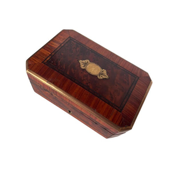 A charming 19th century French Napoleon III jewelry box crafted in richly figured burl wood with contrasting wood banding...