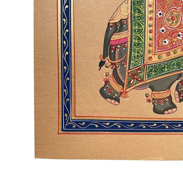 A beautiful hand-painted portrait of an elephant in full Indian wedding regalia. The animal is shown mid-stride and is...