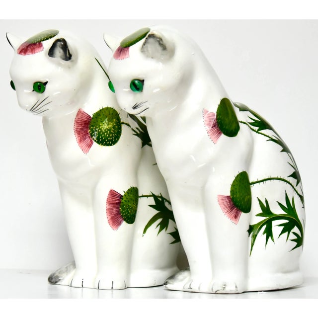 A pair of stylish and delightful vintage Wemyss (pronounced Weems) Ware ceramic cats, having attractive emerald green...