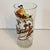 The glass features Sam Sheepdog holding a lasso, catching Ralph E. Wolf (who looks similar to Wile E. Coyote but is...