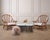 A striking Brutalist style glass and iron coffee table attributed to Marc Weinstein, USA, 1970s. The sculptural piece...