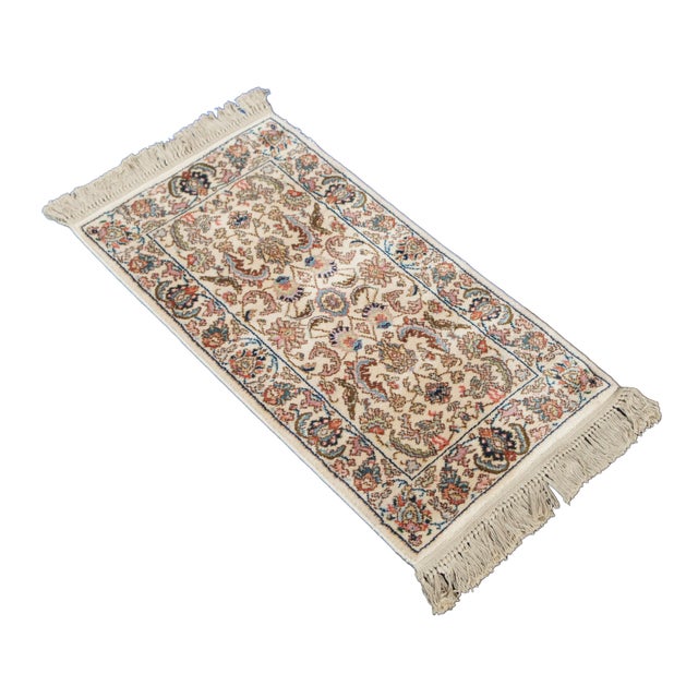 Vintage Karastan 100% wool area rug / mat / carpet featuring a floral motif inspired by palmettes and scrolled vines with...