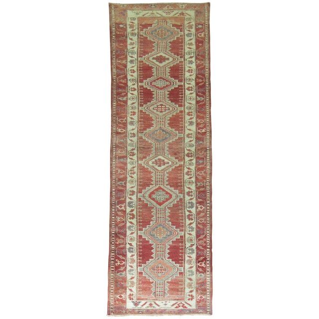 Vintage Turkish geometric tribal motif runner from the mid-20th century. Measures: 2'10" x 11'7".