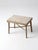 Antique primitive stool with a worn, timeworn painted surface and a quiet, understated presence. The faded tones and...