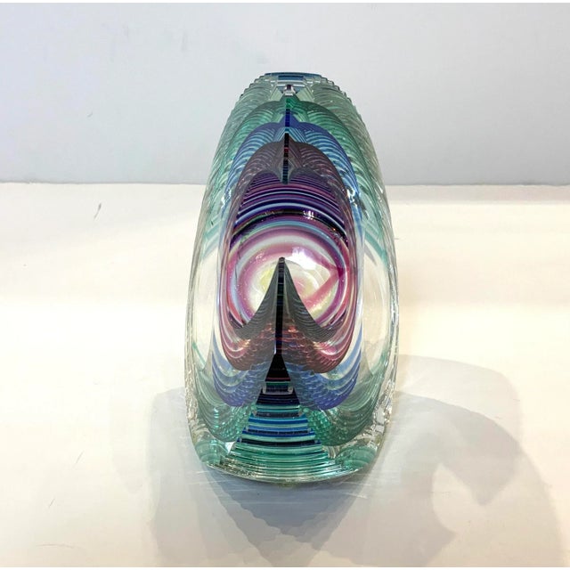 1980s Kit Karbler Glass C shape Sculpture. Its transparent with Blue, Green, Purple and yellow colors. Textured and heavy.