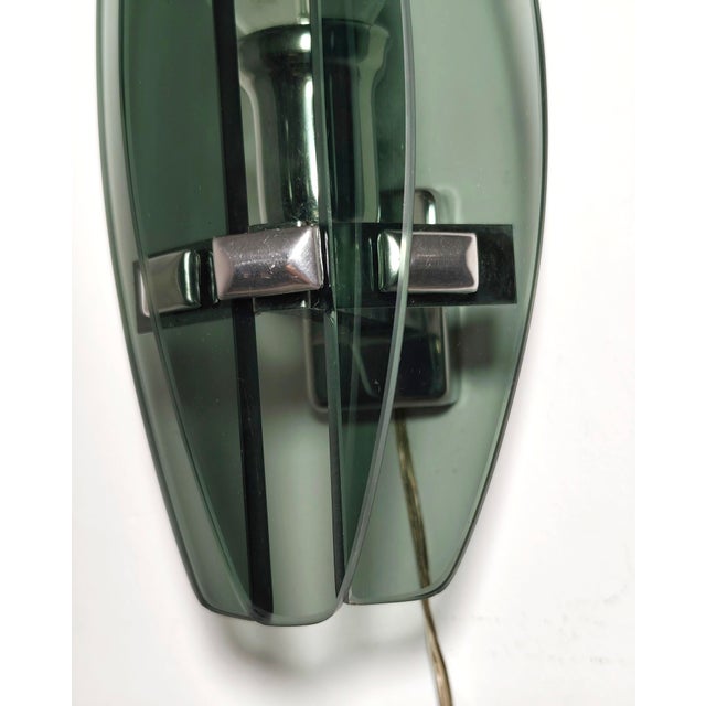 Wall Sconce with Smoked Glass. Italy, 1970s, in Very Good conditions. Designed 1960 to 1969 European Plug (up to 250V).The...