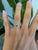 A natural colour-change alexandrite sits at the centre of this solid 14K white gold ring, framed by fourteen earth-mined...