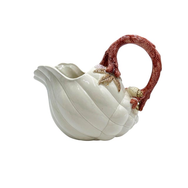 This sculptural Fitz & Floyd “Oceana” pitcher, produced in 1989, is a standout example of the brand’s theatrical coastal...