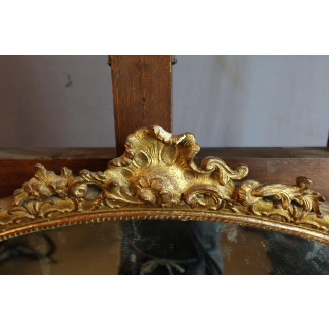 Giltwood Bérain mirror, 18th century. Good condition. DIMENSIONS: 1.10m x 0.74m