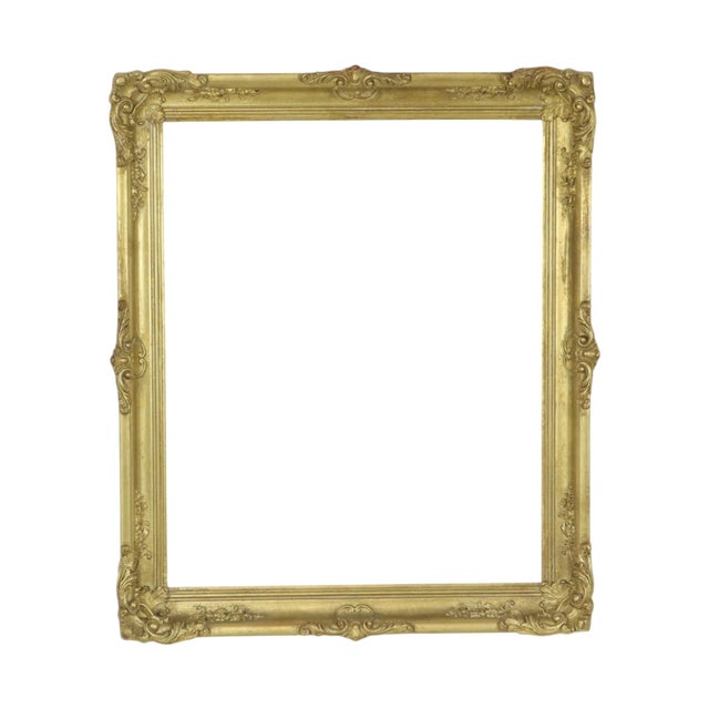 Vintage gold-colored pine frame featuring acanthus and floral ornamentation in a classic Baroque style, 20th century. This...