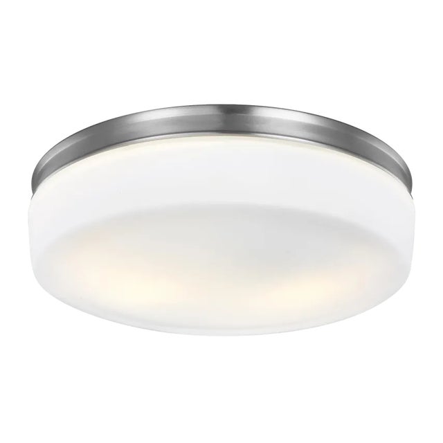 The Issen Flush Mount lighting collection uses a delicate, pressed, White Opal Etched glass diffuser, which is presented...