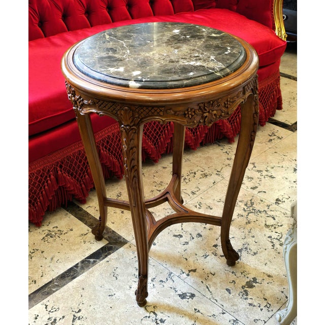 Bring classic French elegance to your interior with this beautiful Louis XV-inspired side table, featuring a rich wood...