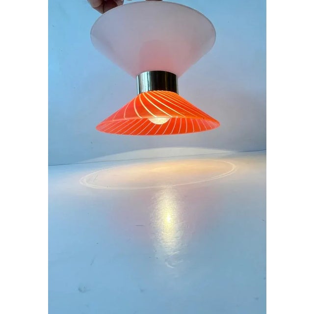 Diablo shaped opaline glass and red stripes matte glass hanging lamp with center brass disc. Anonymous danish maker/design...