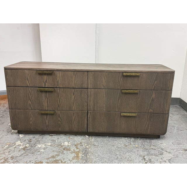 Design Plus Gallery presents a Ciro Six-Drawer Dresser by Julie Lawrence for Restoration Hardware. The dresser is composed...