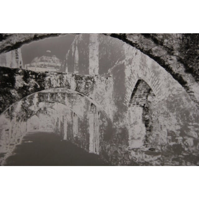 Black and white interior photograph developed using the Sabattier process. The photograph is not framed. Artist Biography:...