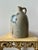 Large 19th century stoneware jug with a single handle, narrow mouth, cobalt blue bird/floral decoration, and an impressed...