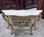 A very elegant carved and gilded wood console table in the louis xv style, featuring a rich rocaille decoration. the...