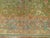 A room size fine antique Turkish Oushak featuring a green background 8'9'' x 11'3''