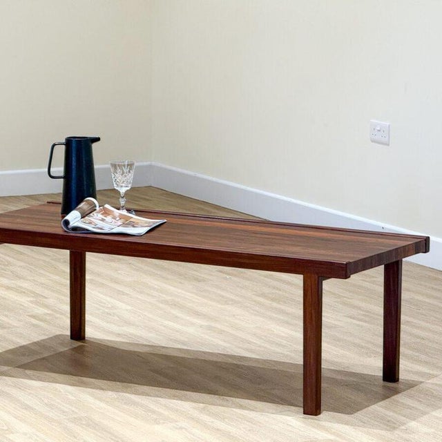 A beautiful mid-century walnut coffee table designed by tom robertson for a.h. Mcintosh in scotland during the 1970s ....