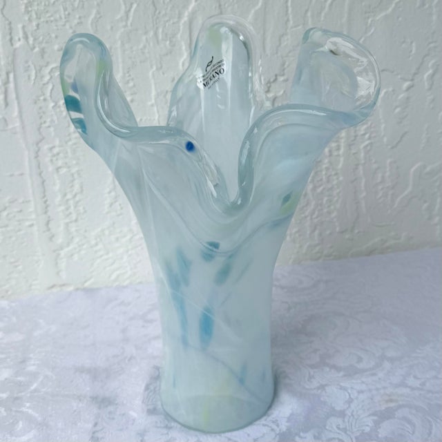 An elegant Italian hand-blown art glass vase crafted in the Murano tradition, featuring a graceful freeform silhouette...