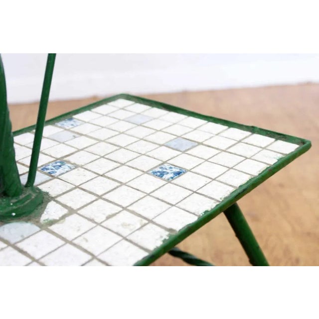 This is a 1970s plant in iron and mosaic With its 3 small metal trays fixed on a concrete iron rod, this plant stand is...