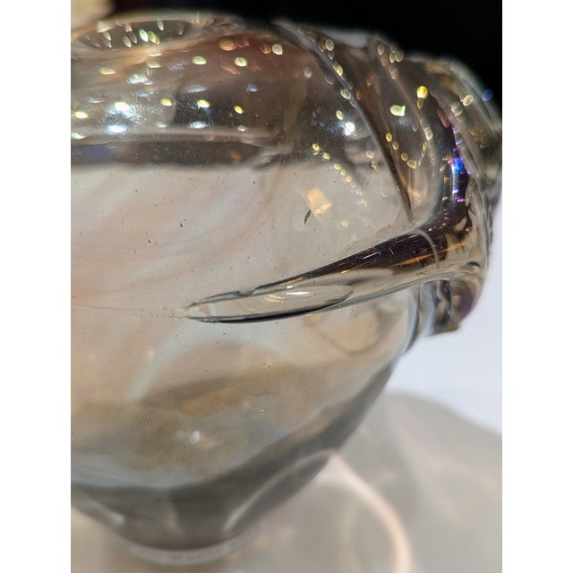 American studio glass bud vase by Jim Wayne. Thick free-blown glass with smoky gray-brown tone and iridescent oxide...