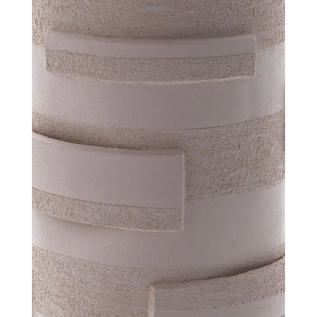 Driven by a deep passion for raw, tactile textures, designer Katia Langeard presents this limited-edition sculptural lamp,...