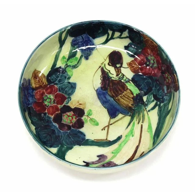 Nice hand decorated English bowl. This piece is sure to bring charm to your home.