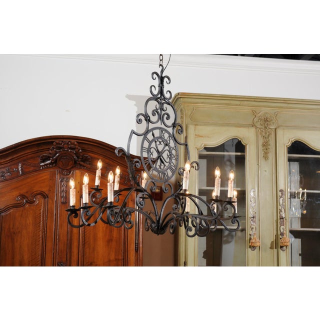 Early 20th Century Early 20th Century French 12-Light Wrought-Iron Chandelier with Clock Motif and Scrolling Armature For Sale - Image 5 of 12