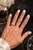 A clean and timeless three-stone diamond ring with a modern edge. This piece features three well-matched princess-cut...