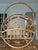 Elegant Italian magazine rack crafted from bamboo and woven rattan, dating to the 1950s. This charming mid-century piece...