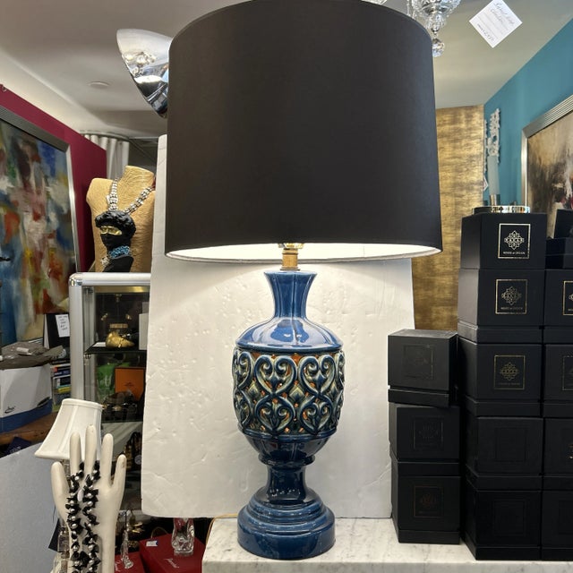 Blue ceramic openwork lamp with custom black shade. The top and bottom light sources work together as well as...