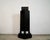 Vintage 1990's Post Modern pedestal for sale. It's a unique pedestal in black laminate, and has a great design to it. It...
