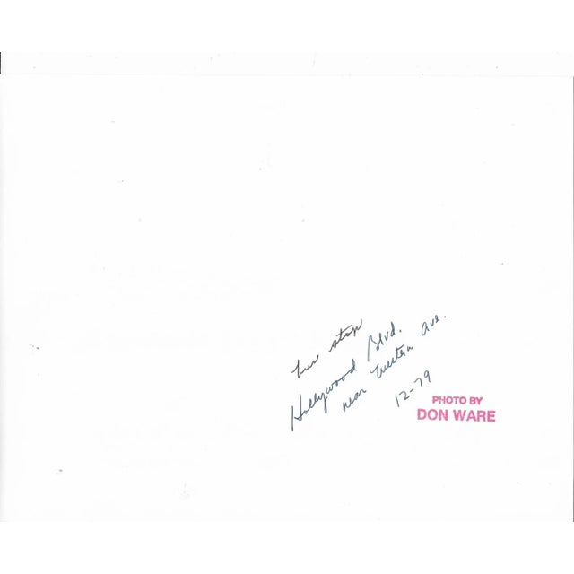 1979 black and white photo by Los Angeles, California by Don Ware (1921-2006) of a bus stop on Hollywood Boulevard near...