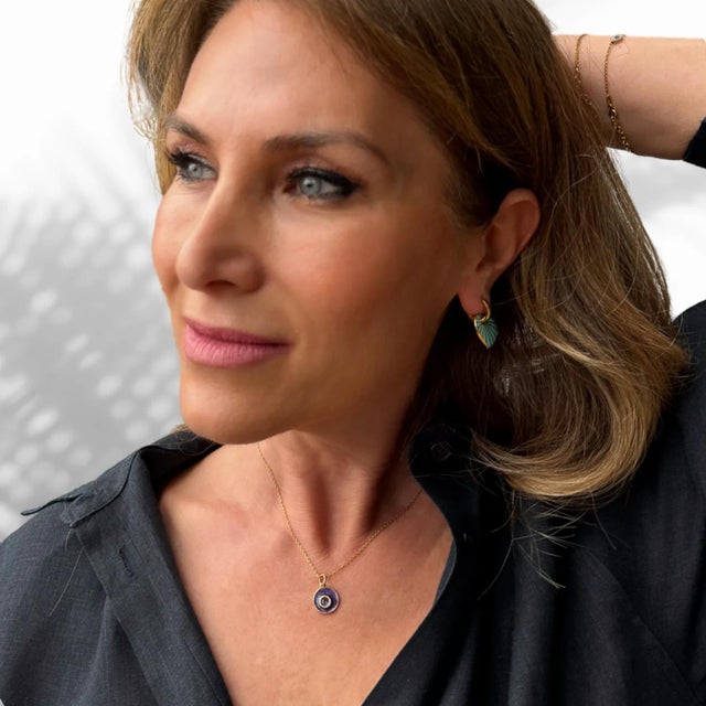 Wear the Purple Enamel Amethyst Stone Evil Eye Pendant Gold Chain Necklace as a daily reminder of positive energy and...