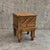 Wooden sewing table features an extendable scissor-action mechanism with multiple storage compartments and stands on...