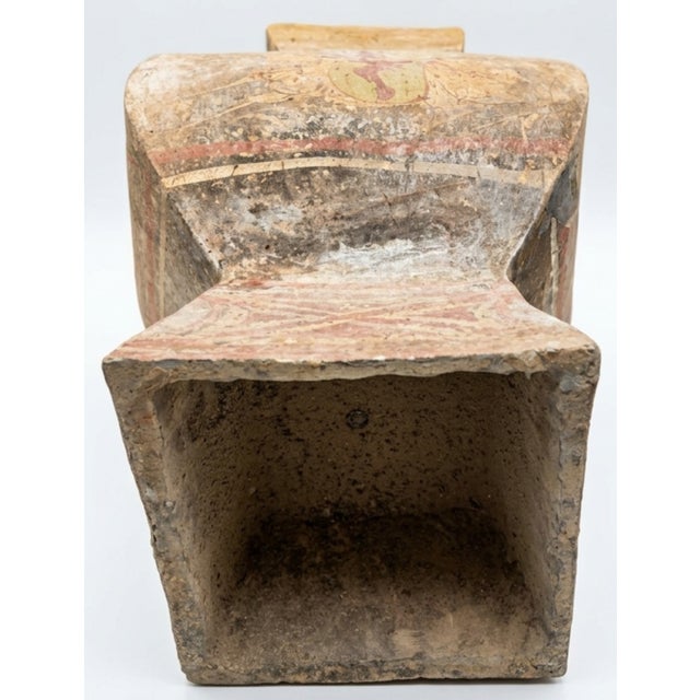 This object appears to be a Chinese painted pottery vessel, or hu, generally attributed to the Han dynasty or the Warring...