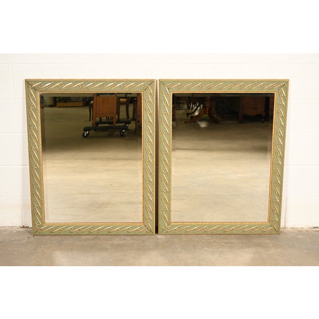 A gorgeous pair of Italian Regency Louis XVI style wall mirrors In the manner of John Widdicomb Italy, Circa Late 20th...