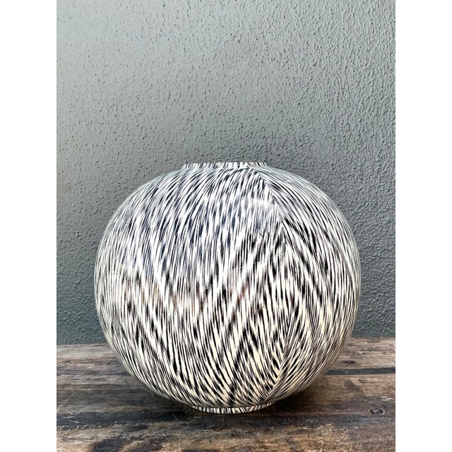 Add a bold graphic element to your interior with this striking spherical vase by Bellini Italy. Masterfully crafted in...