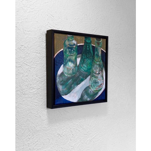 Contemporary Captivate by Tracy Wall | Oil on canvas Still life of three green glass bottles on a plate For Sale - Image 3 of 5