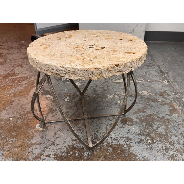 Design Plus Gallery presents an Artisan Made Fossilized Stone Side Table. The round top is formed from fossil stone with...