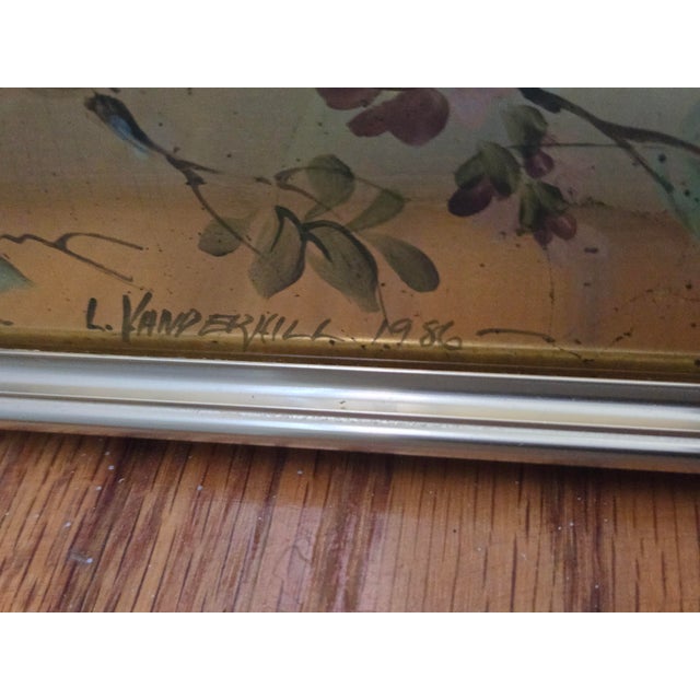 Vintage LaBarge chinoiserie églomisé reverse painted gold leaf mirror featuring a nature-inspired motif on a reeded brass,...