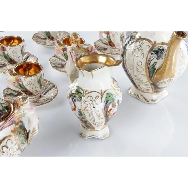 Coffee service in capodimonte porcelain and gold zecchino composed of six cups, milk jug, sugar bowl and coffee pot.