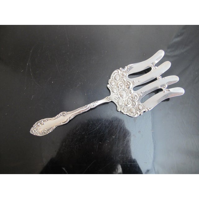 Stunning antique Durgin sterling silver asparagus serving fork. I'm unsure of pattern, it's a very ornate, raised floral...