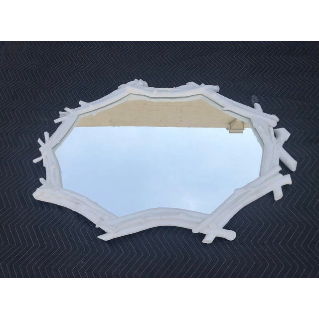 This is a Sirmos mirror. It is faux plaster natural and in great condition.