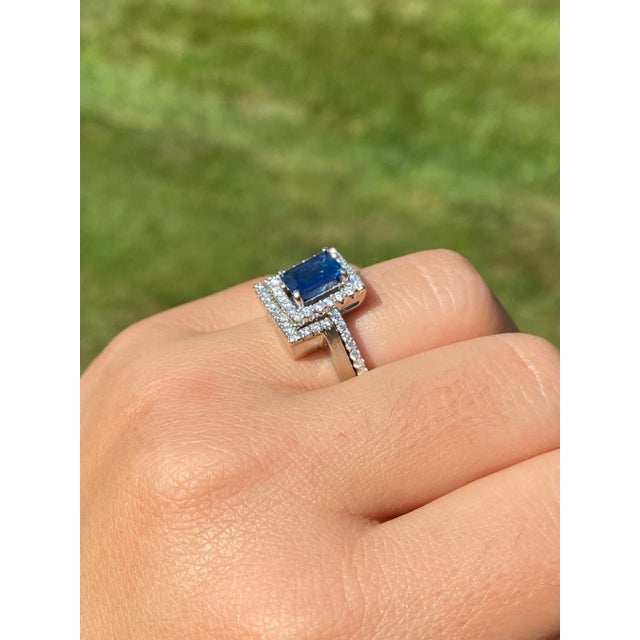 The Bell Mountain: Diffused Emerald Cut Blue Sapphire Engagement Ring and Wedding Set with Custom Band. The engagement...