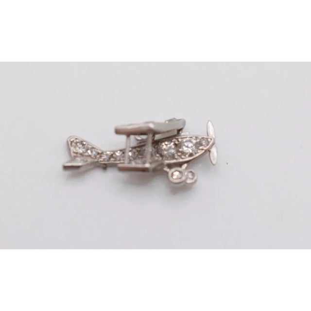 This is a stunning bi-plane charm. It is covered with diamonds. This is the perfect charm for any necklace or bracelet!...