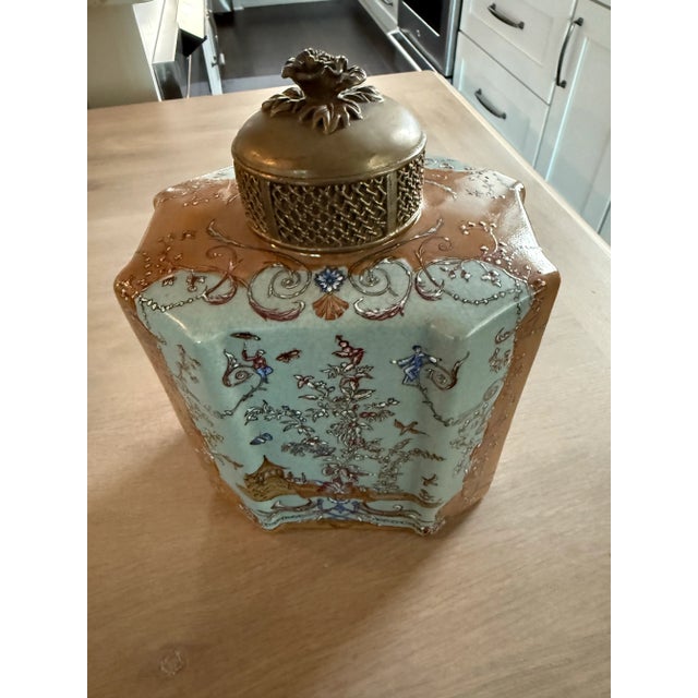 Vintage hand painted porcelain jar with lid. Please see the pictures for the beautiful oriental scene painted on the...