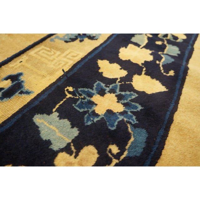 Antique Ivory Beige Cream White 1920s Wool Hand Knotted Pile Rectangle Rug, Circa Date: 1920s. This exquisite example of...
