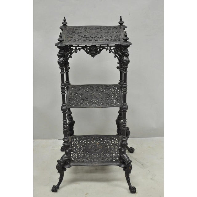 Antique French Renaissance Victorian Cast Iron Figural 3 Tier Black Painted Plant Stand Side Table. Circa Late 19th...